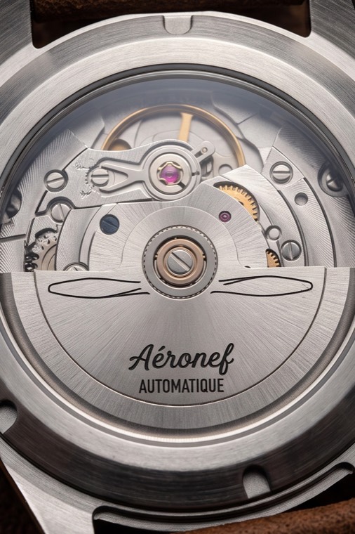 Fond transparent de l'Aéronef, masse oscillante gravée.